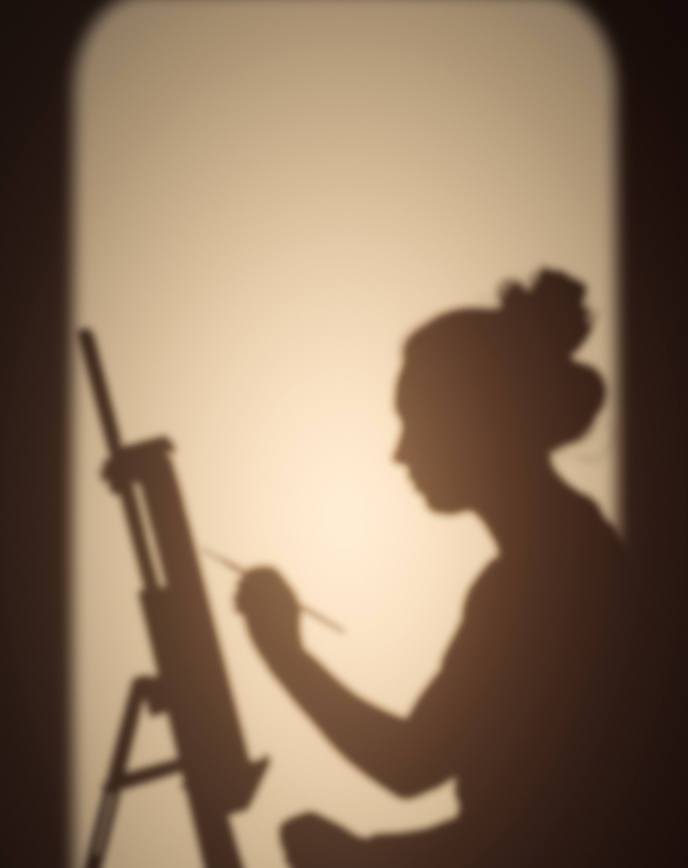 Shadow of a woman painting on a canvas