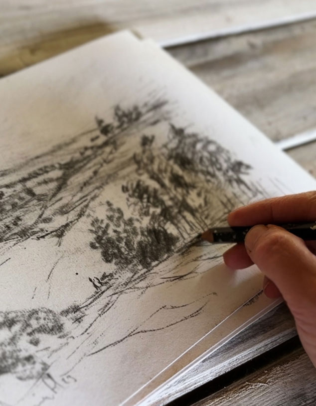 Dan Hobday sketching a landscape scene